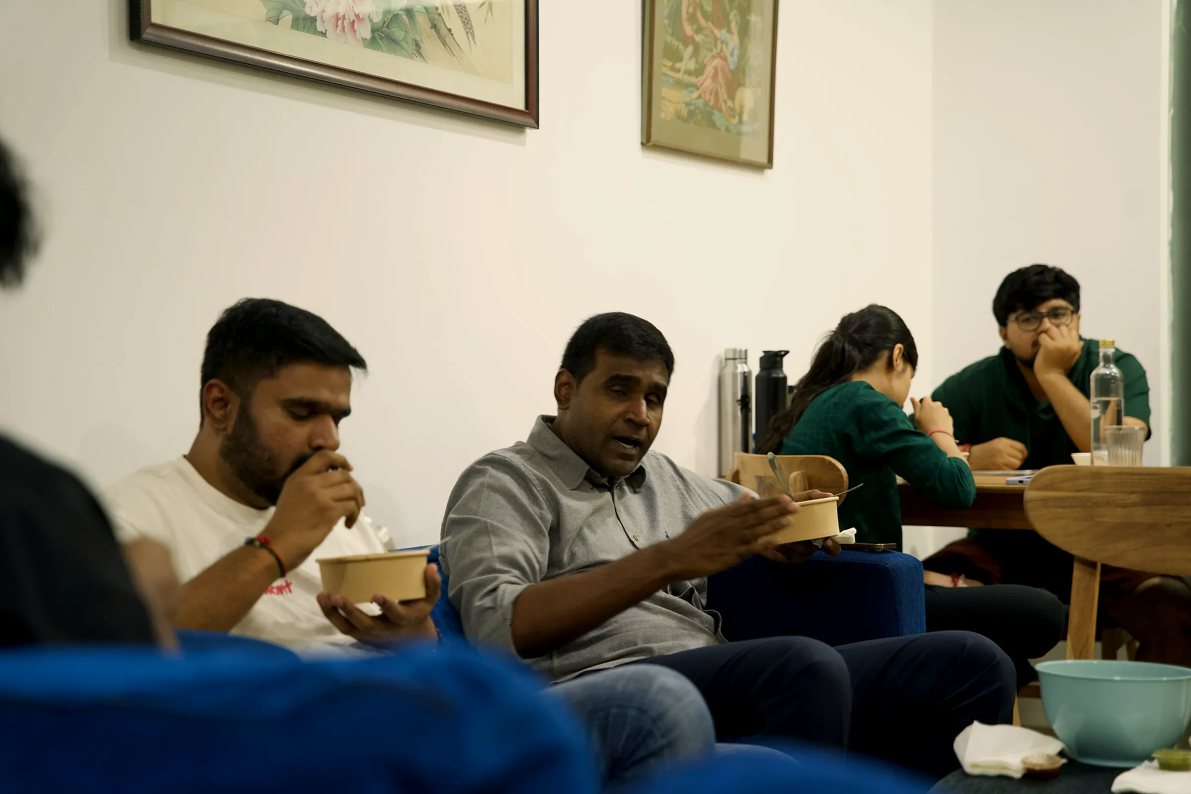 Founders eating together on the sofas
